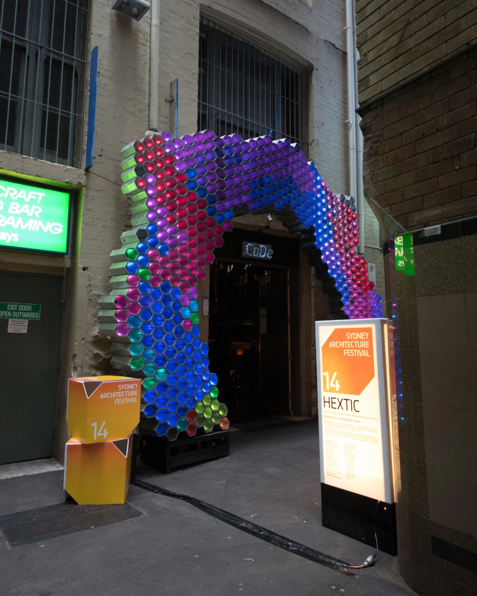 Photograph facing north of the HEXTIC installed at the door of the Grasshopper Bar in daylight for the Sydney Architecture Festival 2014