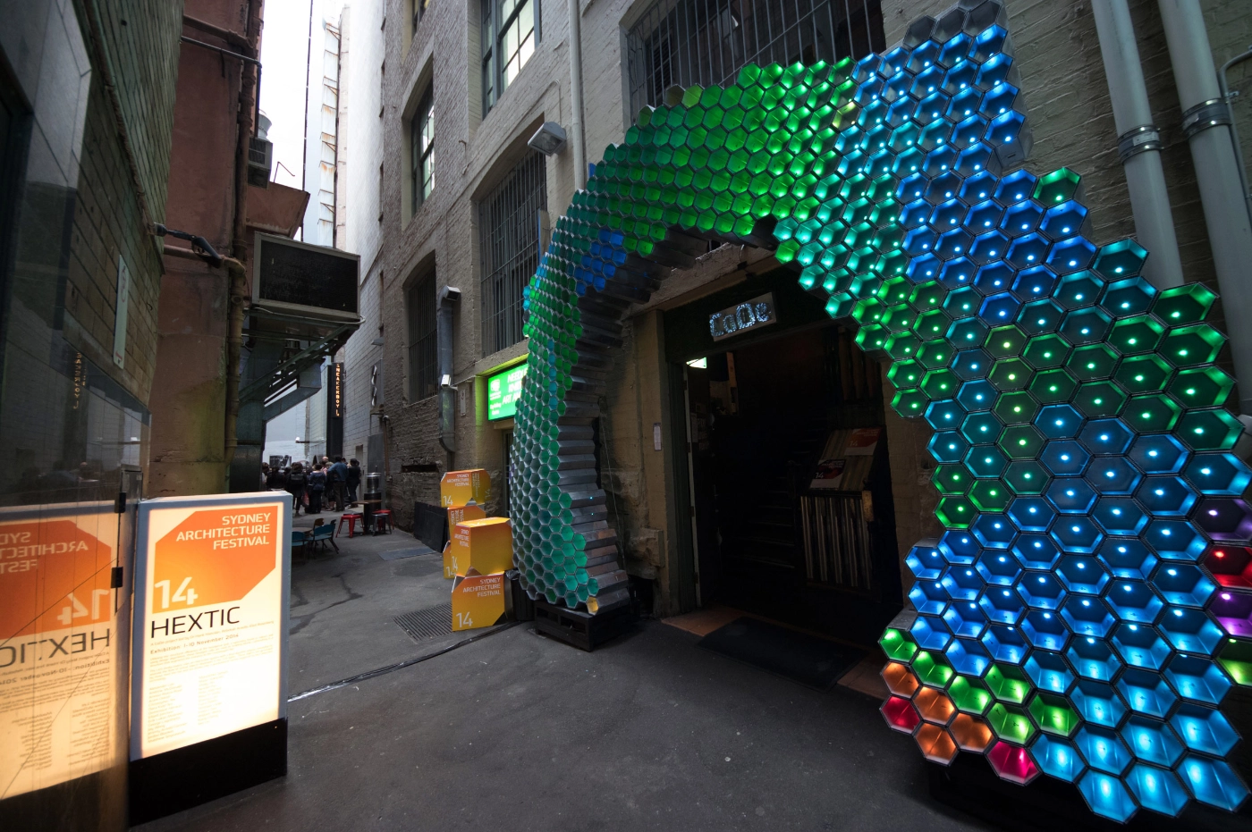 Photograph facing south of the HEXTIC installed at the door of the Grasshopper Bar in daylight for the Sydney Architecture Festival 2014