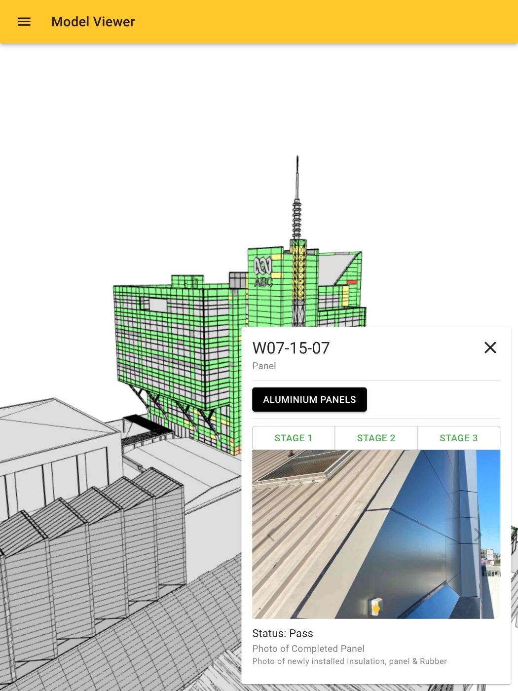 screenshot of a building with coloured panels (green, red, yellow and gray). In the bottom right is a selected panel with a photograph of the panel.